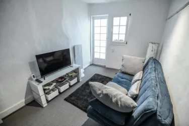 Wohnzimmer (© Kleines Ferienhaus Weiler)