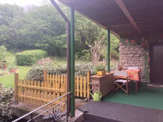 Die Veranda mit Zugang zum Garten