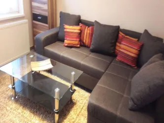 Wohnbereich mit Schlafcouch Apartement 2